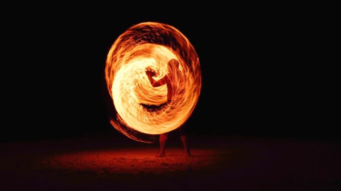 Firedancing man by pj24dm (Unsplash.com)