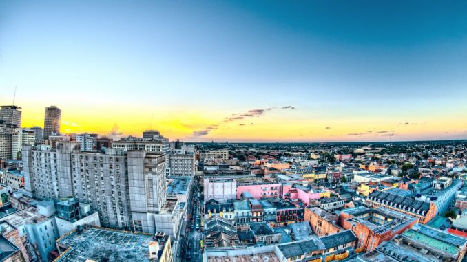 Shot from the top of the Hotel Monteleone at Sunset in New Orleans. This is looking towards Bourbon Street. It was shot during my Honeymoon there. by scottwebb (Unsplash.com)