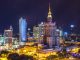 This is Panoramic view of beautifull Warsaw during weekend night. by gliwik (Unsplash.com)