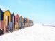 Colorful beach huts on beach by _entreprenerd (Unsplash.com)